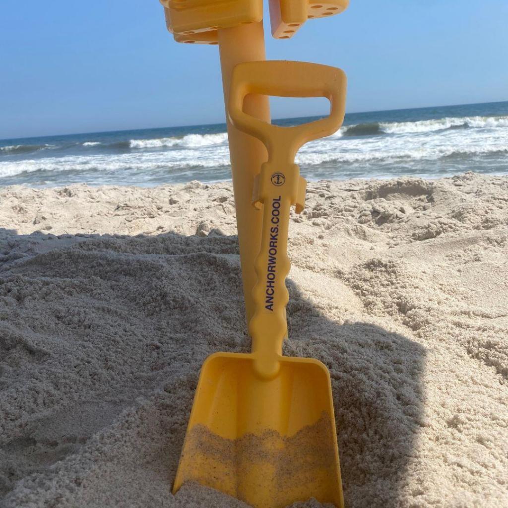 anchor works anchor and shovel on the beach