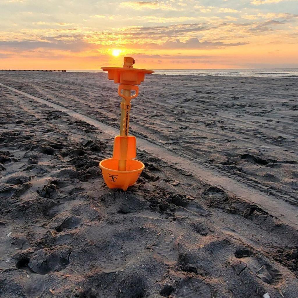 beach umbrella anchor in the sand on a beach